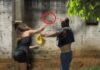 VÍDEO: mulher tem ataque de fúria, agride atual e ex-companheiro a pauladas, pedradas e mordidas em Vilhena